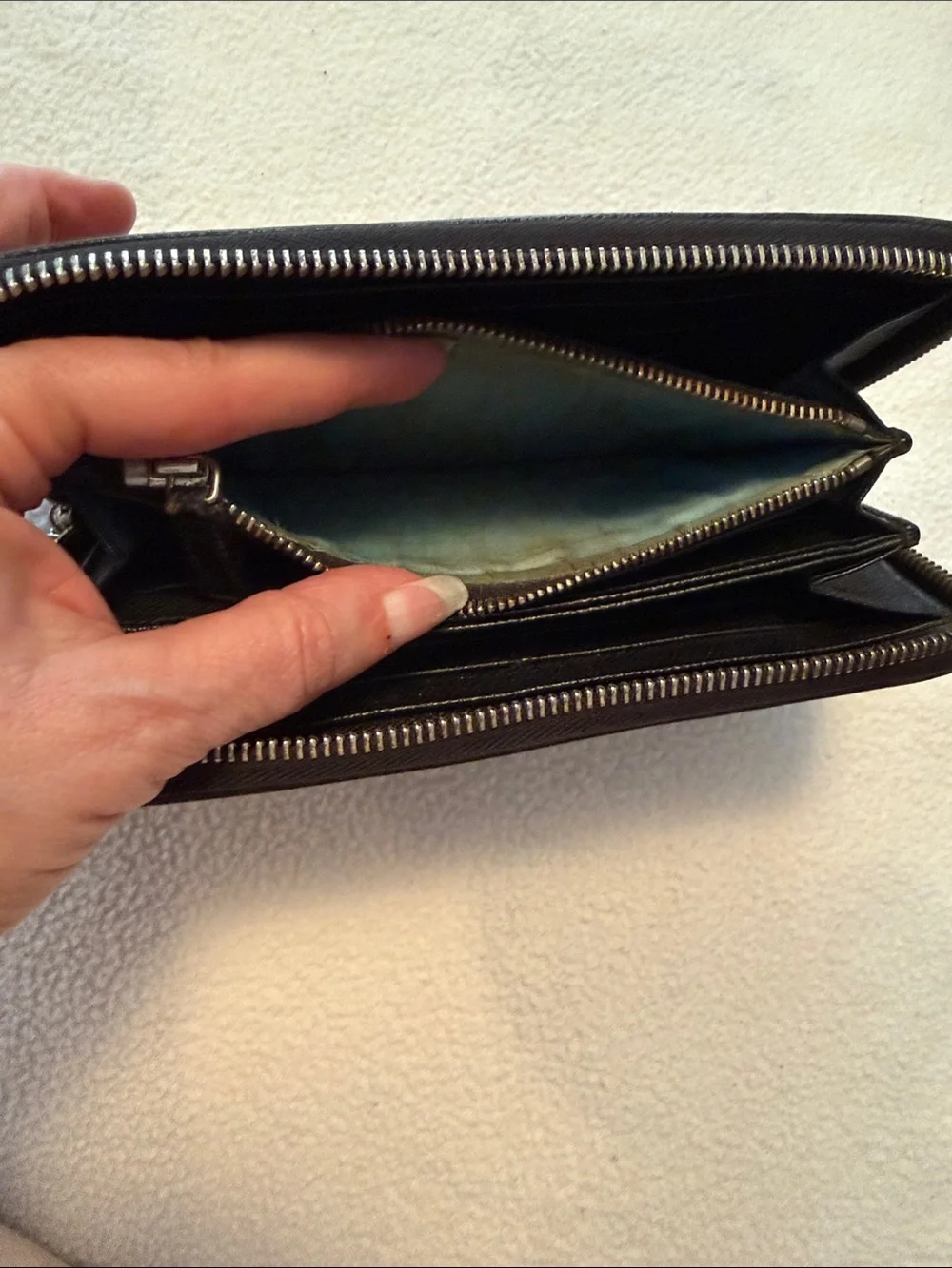 Bvlgari Zip-Around Black Leather wallet with blue interior.